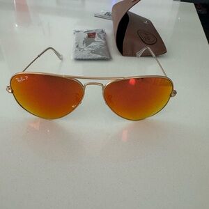 Ray Ban aviator sunglasses. Matte gold frame. Orange flash lenses. Polarized.